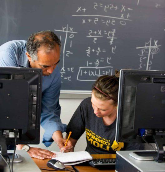 Math professor helping student